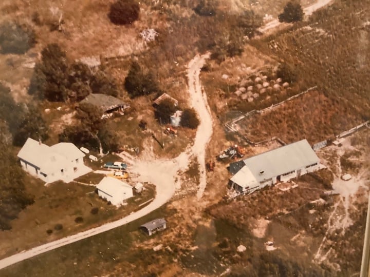 Photo from an airplane of the Sagehorn homestead and dairy barn.