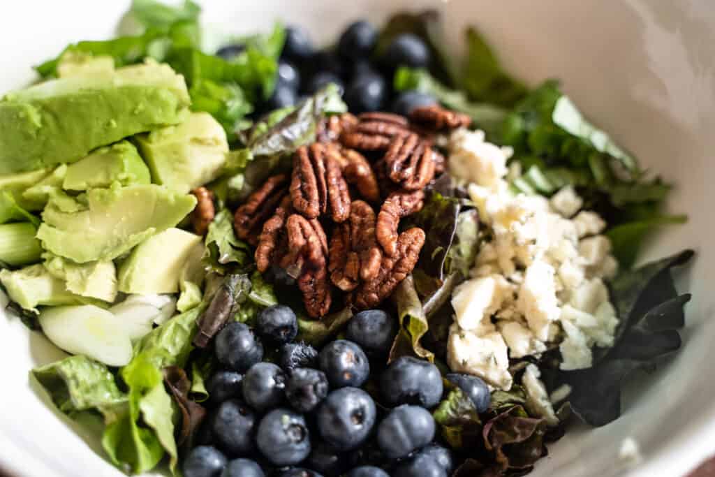 blueberry salad complete with farm fresh blueberries, sweet and spicy pecans, avocado, gorgonzola
