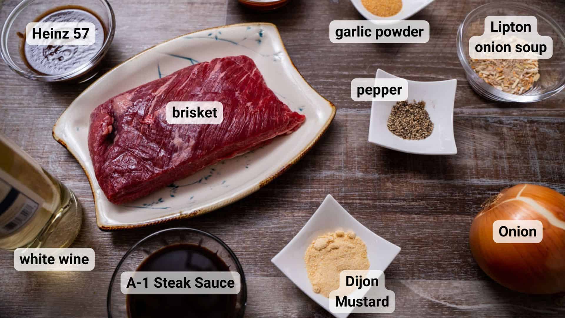 Passover brisket ingredients in clear glass ingredient bowls and white square ingredient bowls.