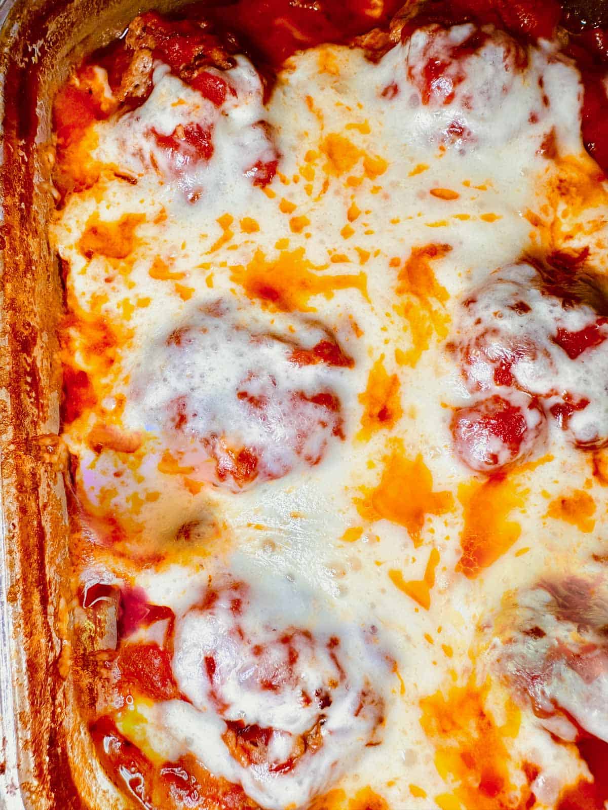 meatballs topped with creamy melted fontina.