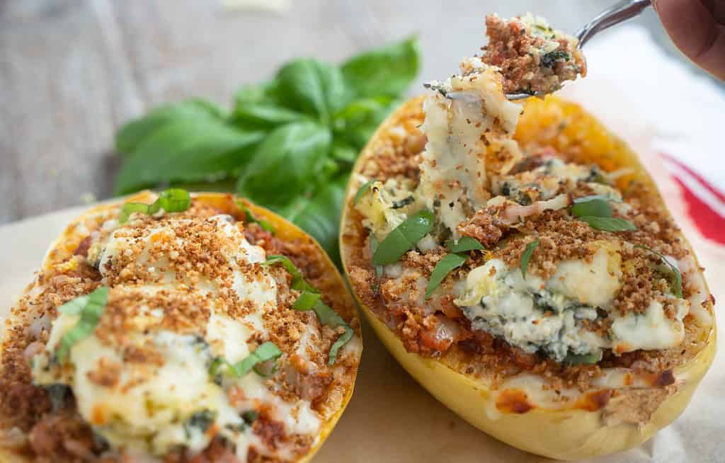 Baked Spaghetti squash lasagna for two with a fork digging into one half