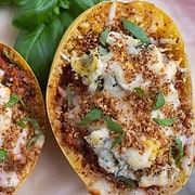 Spaghetti Squash Lasagna is a spaghetti squash split in half stuffed with lasagna ingredients