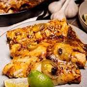 Tex Mex Cheese Enchiladas for two in a cast iron skillet and served on a plate