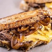 Brisket grilled cheese on parchment paper