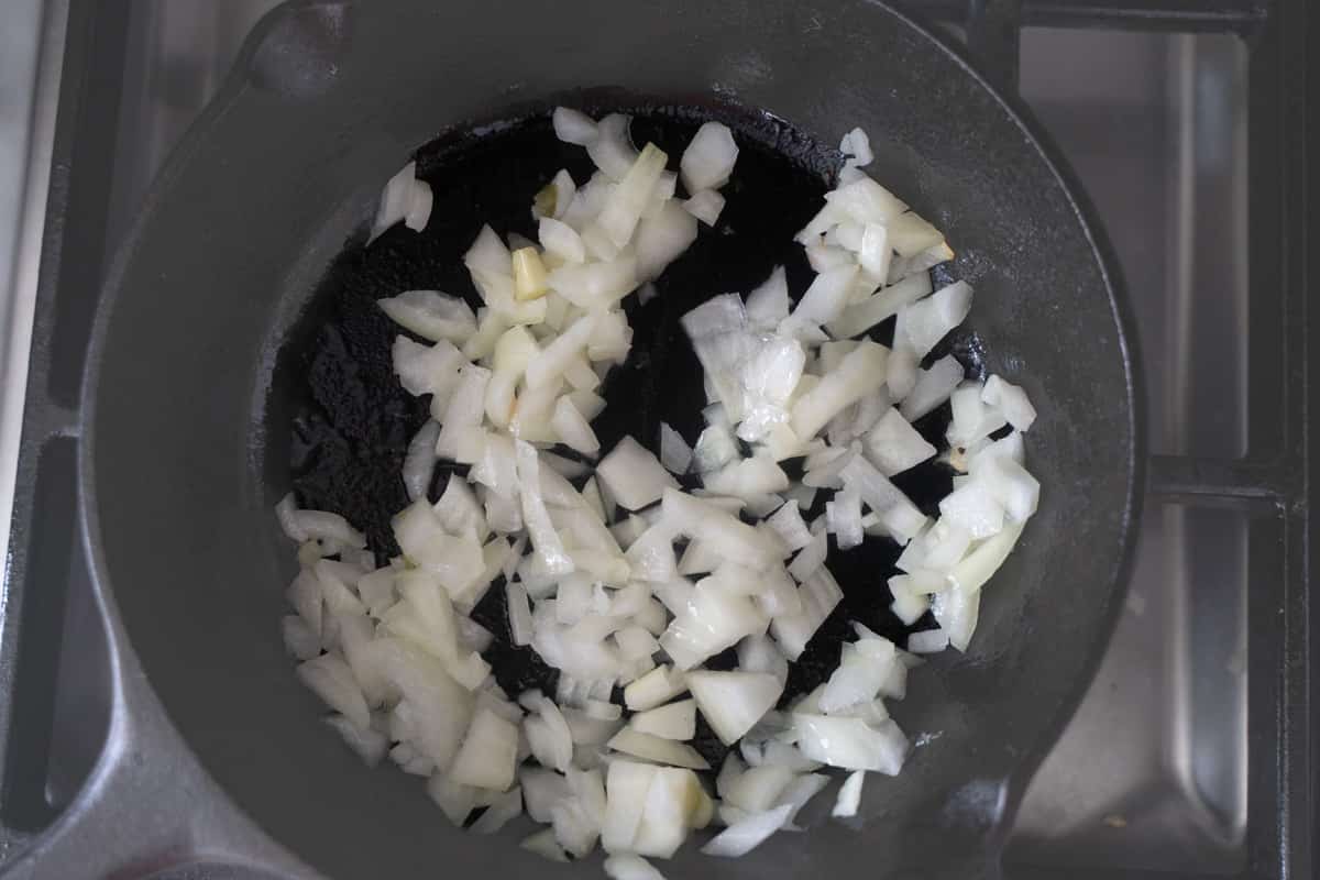 chopped onion in a cast iron skillet