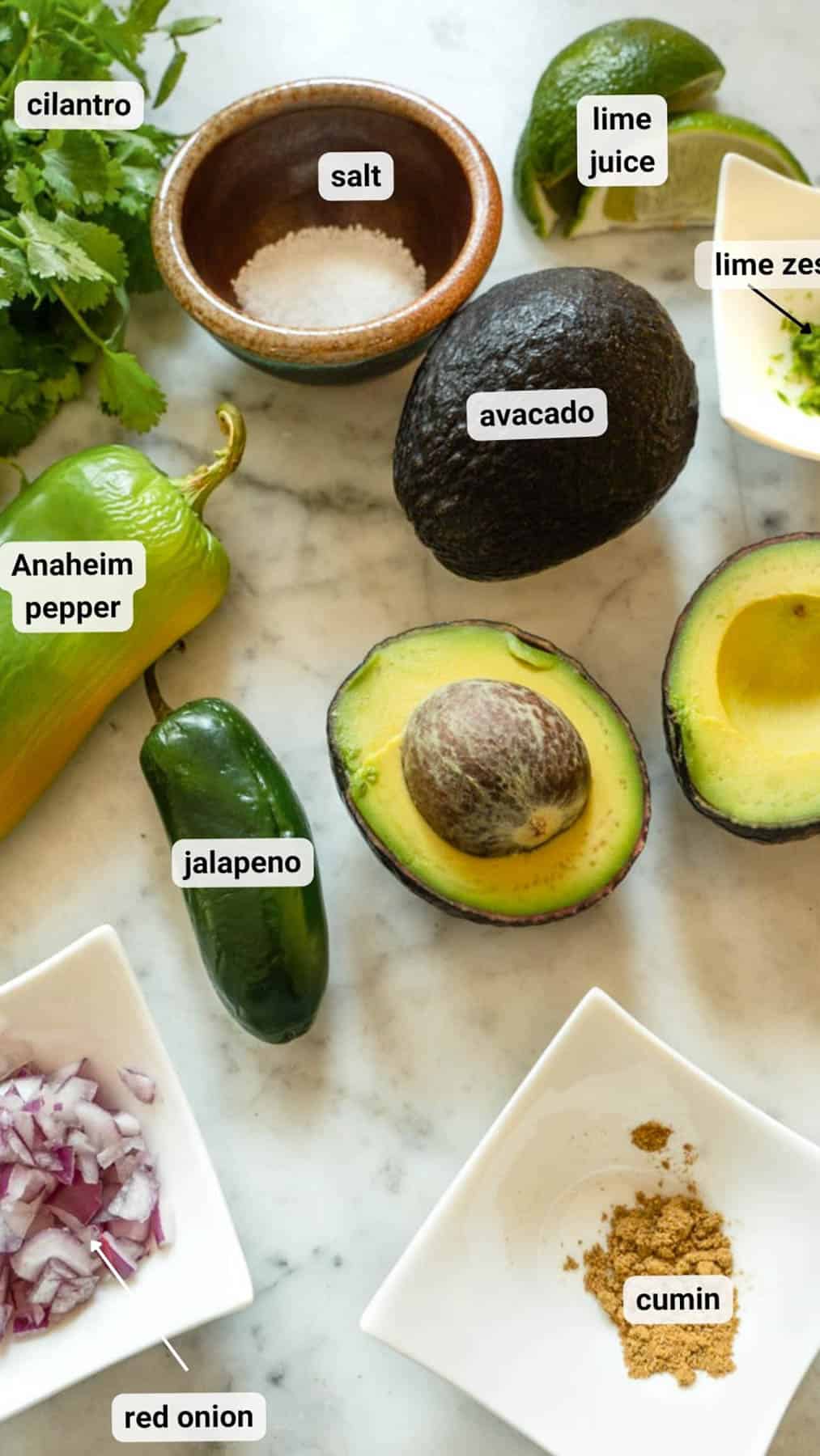 Small batch Guacamole Ingredients sitting on a marble counter top