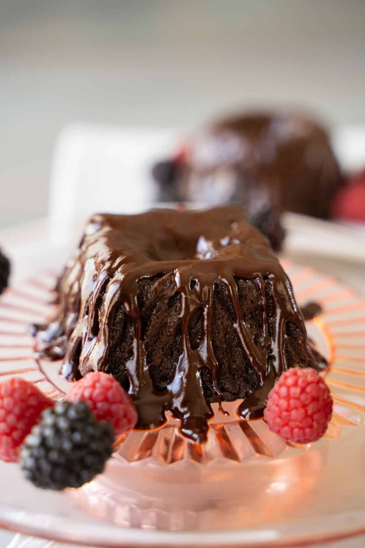 glazed mini chocolate bundt cakes on cake platter