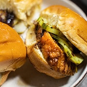 pork sliders with a maple glaze and pickles on a soft slider bun
