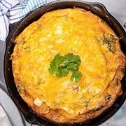 Mexican Frittata in a cast iron pan with cilantro garnish