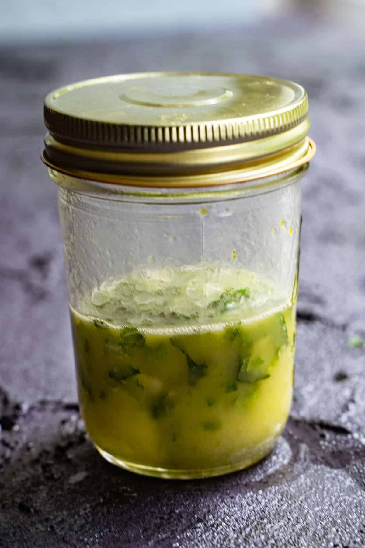 lime dressing ingredients shaken in mason jar