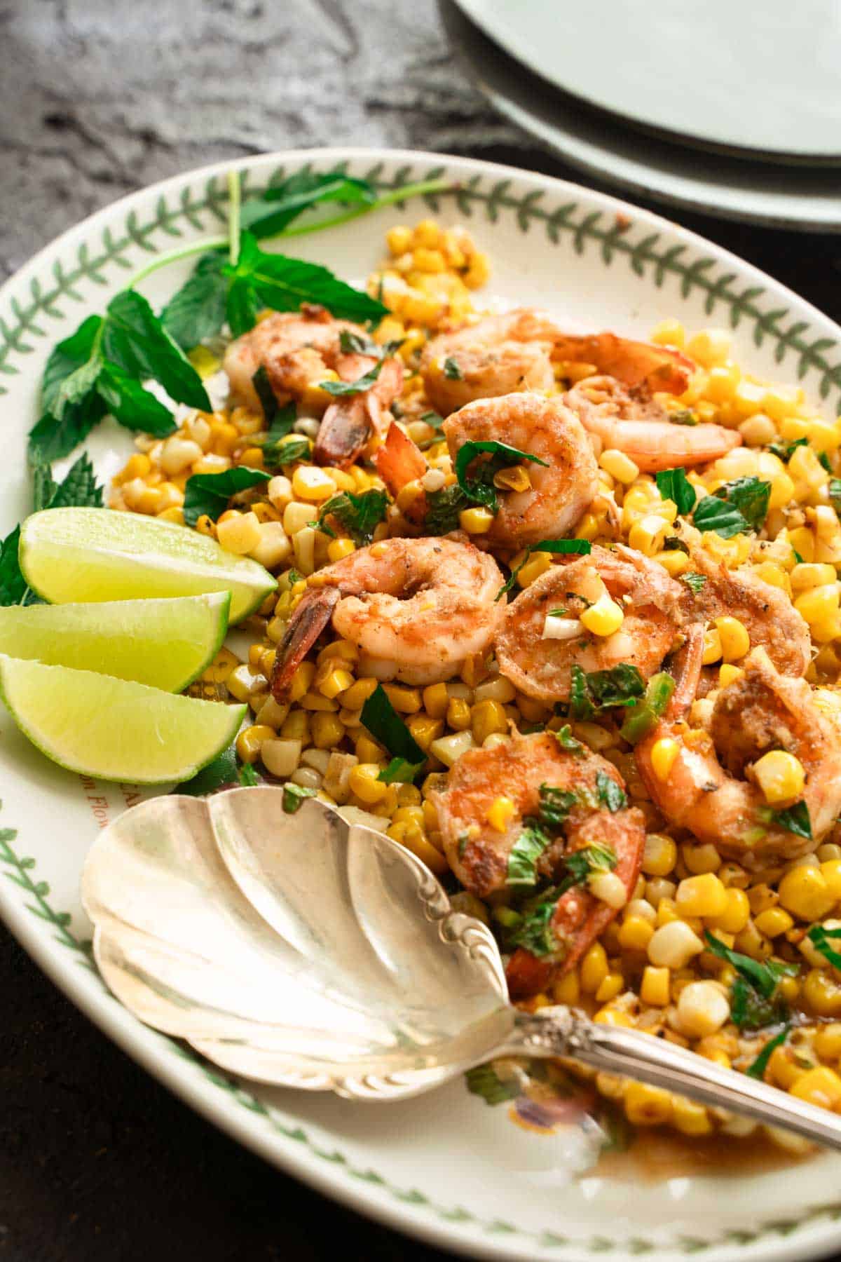 shrimp and corn tossed with lime dressing on a serving platter