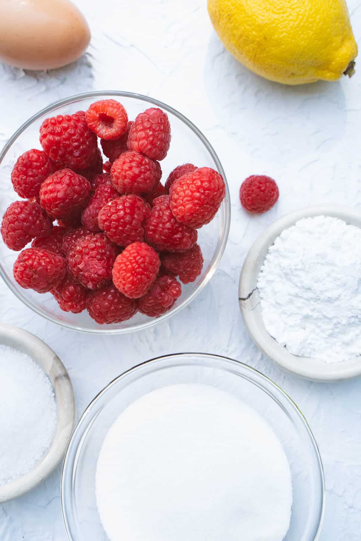 Raspberry Ice Cream ingredients in a bowl on a white table