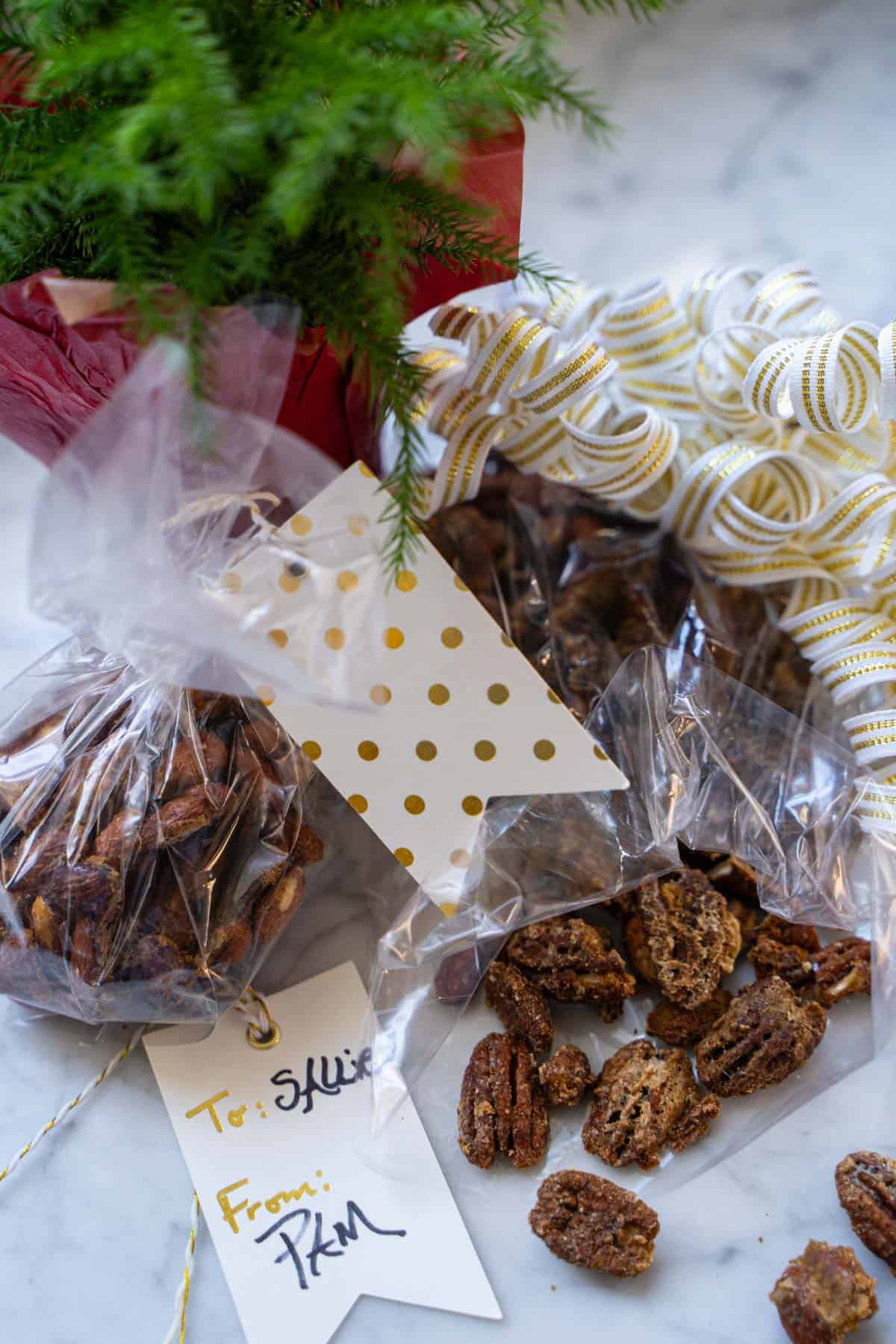 Sweet and Spicy Nuts in a gift bag open on a marble counter.