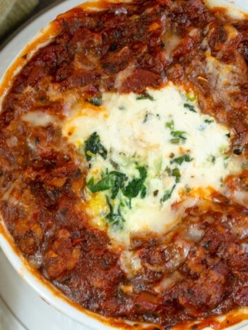 easy lasagna for two recipe using lefover pot roast made in an individual white ramekin.
