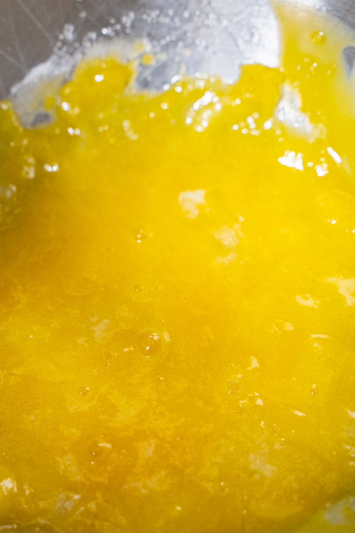 egg yolks and sugar combined in a stand mixer bowl to make creme brulee.