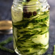 Quick pickled cucumbers in a mason jar.