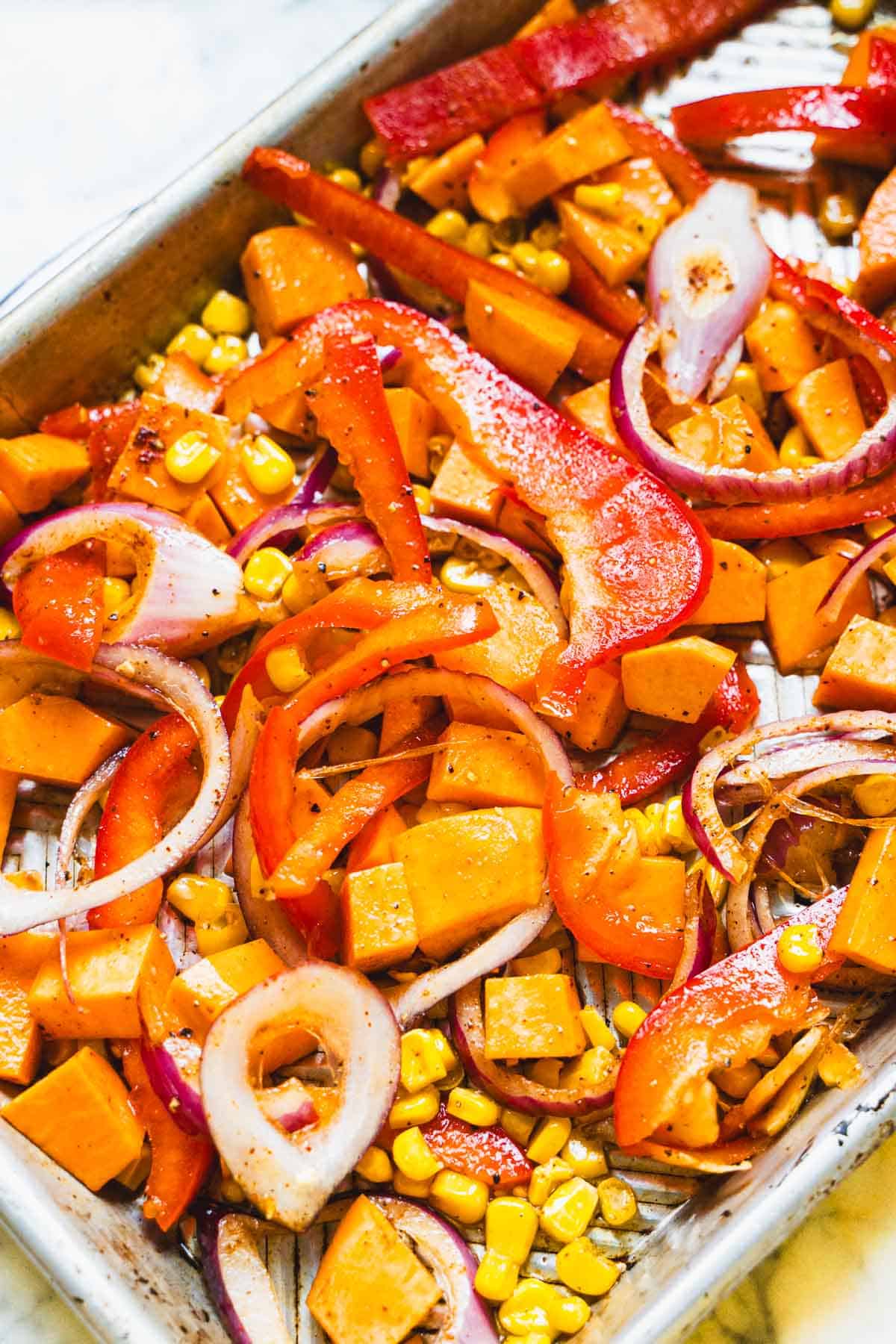 Vegetable Bowl veggies on baking sheet ready to be put into the oven.