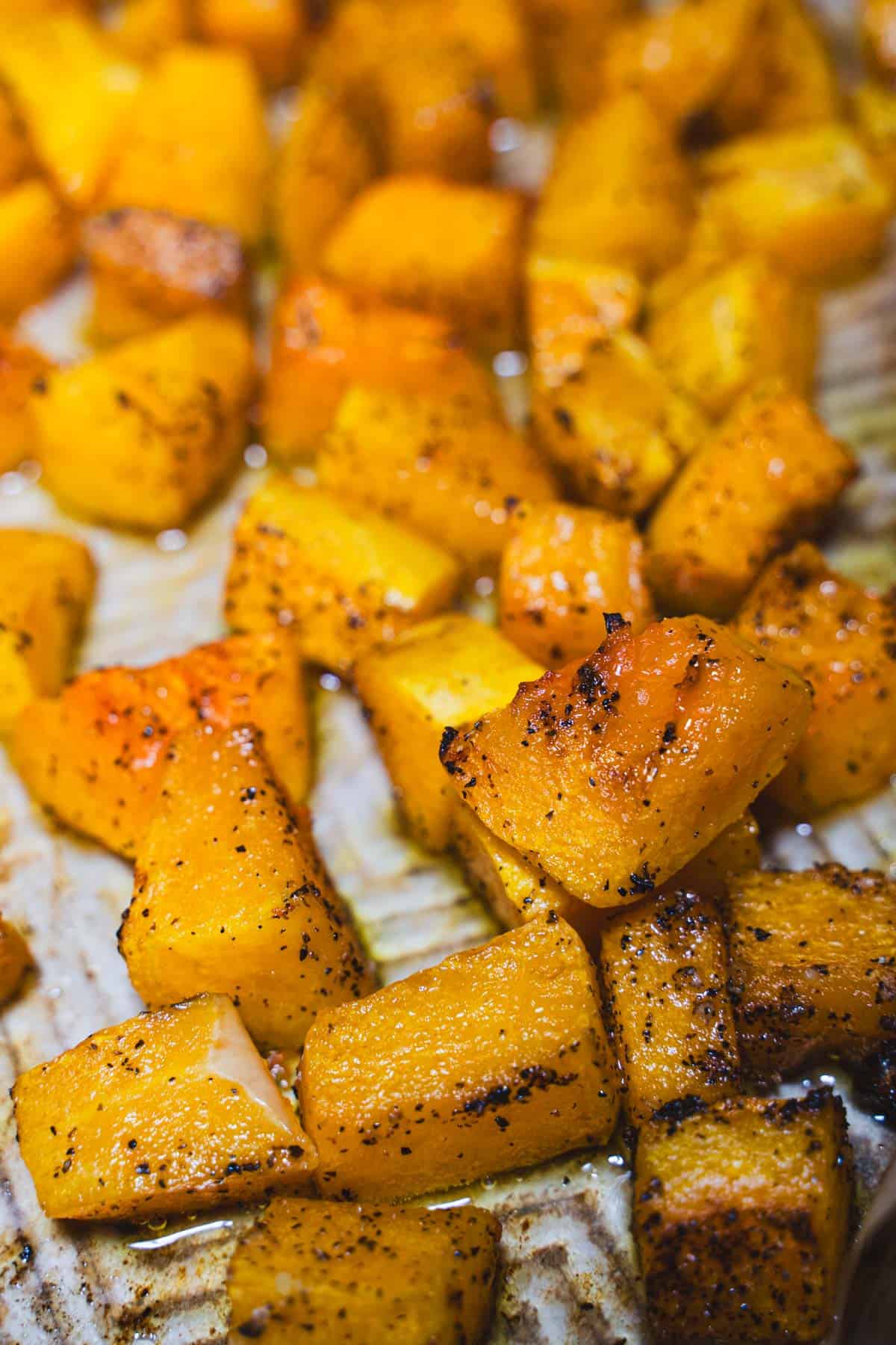 Roasted butternut squash on a baking sheet for adult grilled cheese.