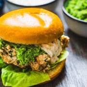 Salmon slider on a brioche bun with mint pea puree and white champagne sauce.