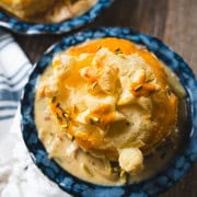 Puff Pastry chicken pot pie in a individual blue pie plate.