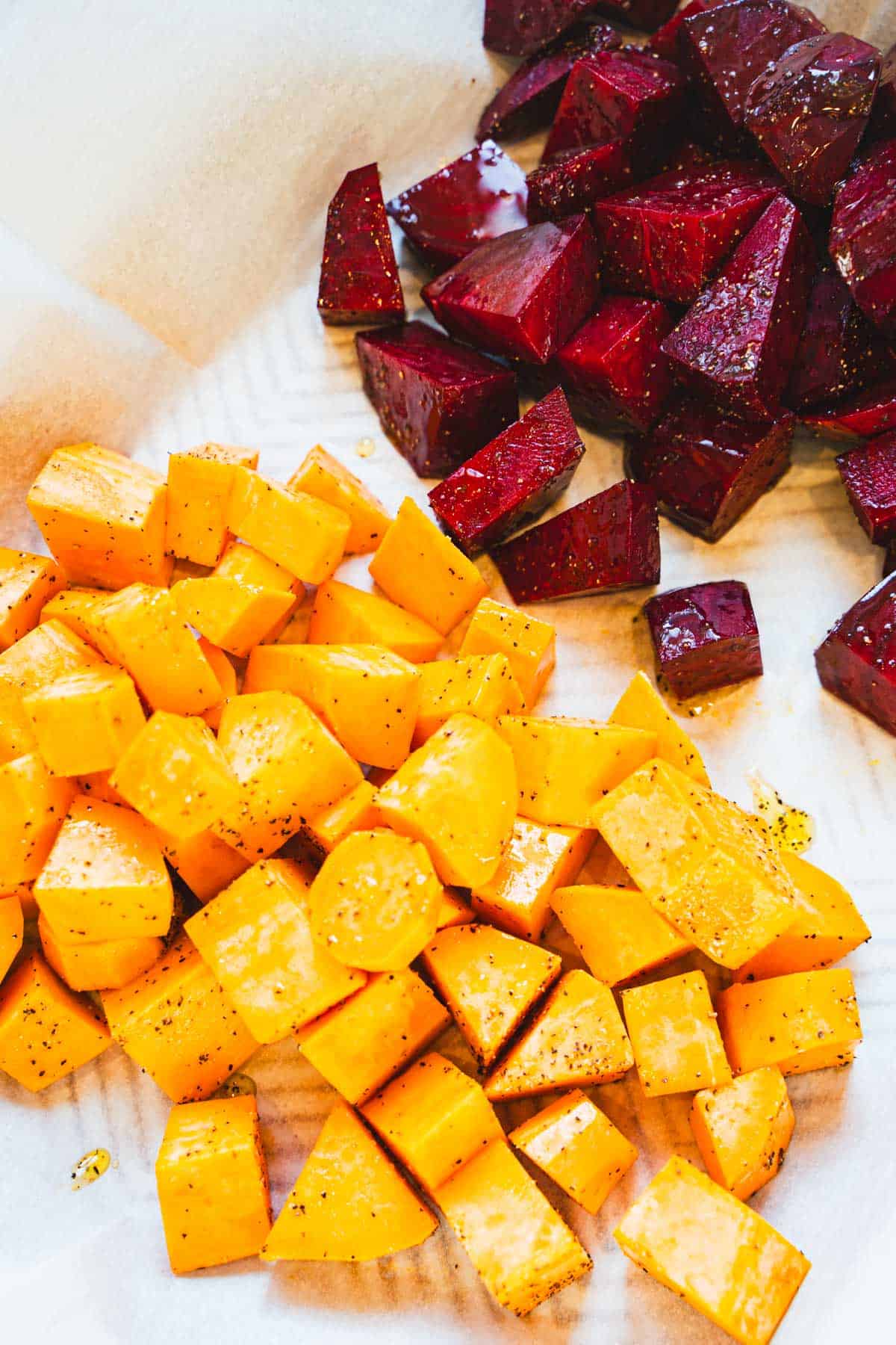 Sweet Potatoes and Beets on sheet pan tossed in olive oil, salt and pepper for Breakfast Hash.