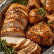 carved roasted chicken on platter.