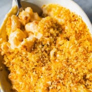 Grown up version of 3 cheese mac and cheese on a spoon in a ramekin.