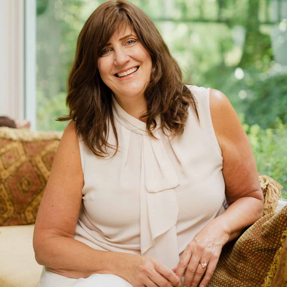 Women sitting in window seat.