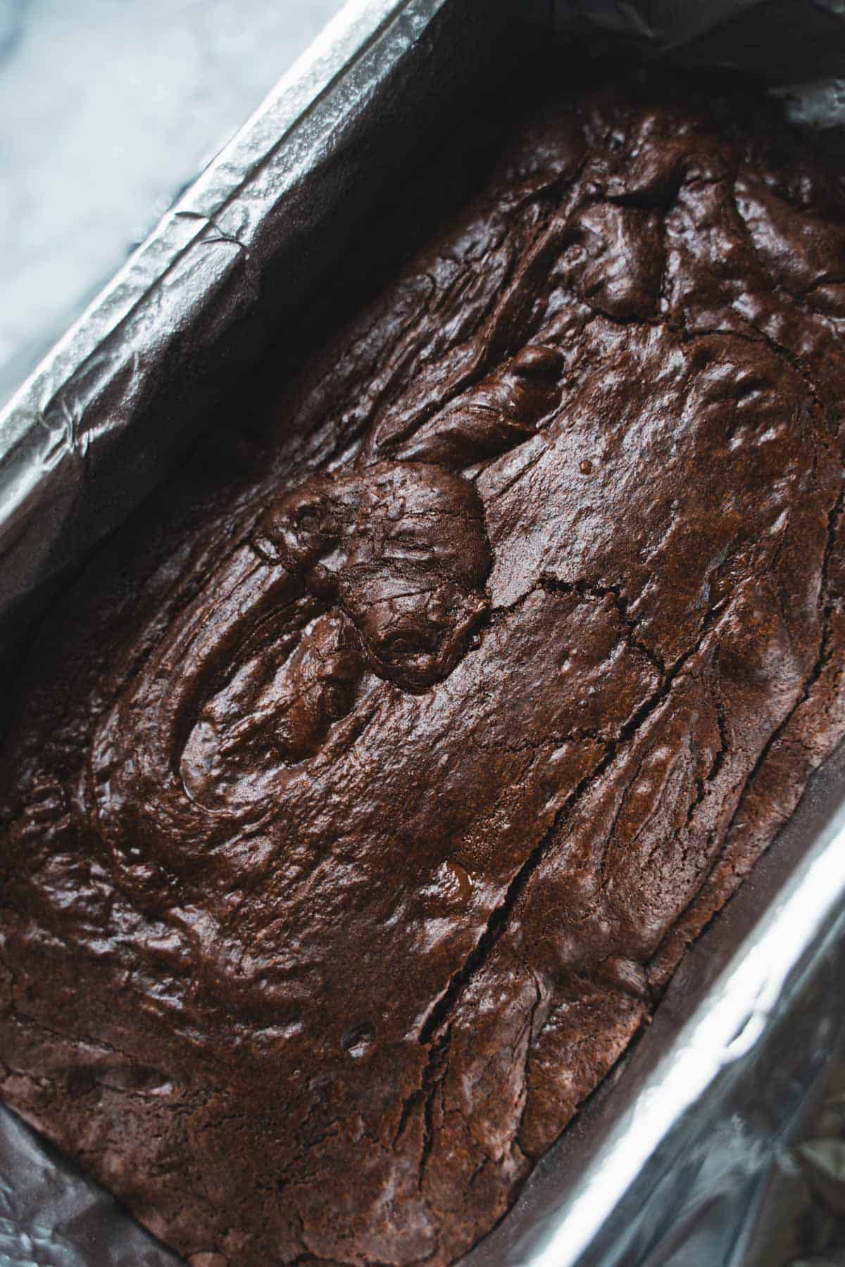 Chocolate brownie base baked in a loaf pan.