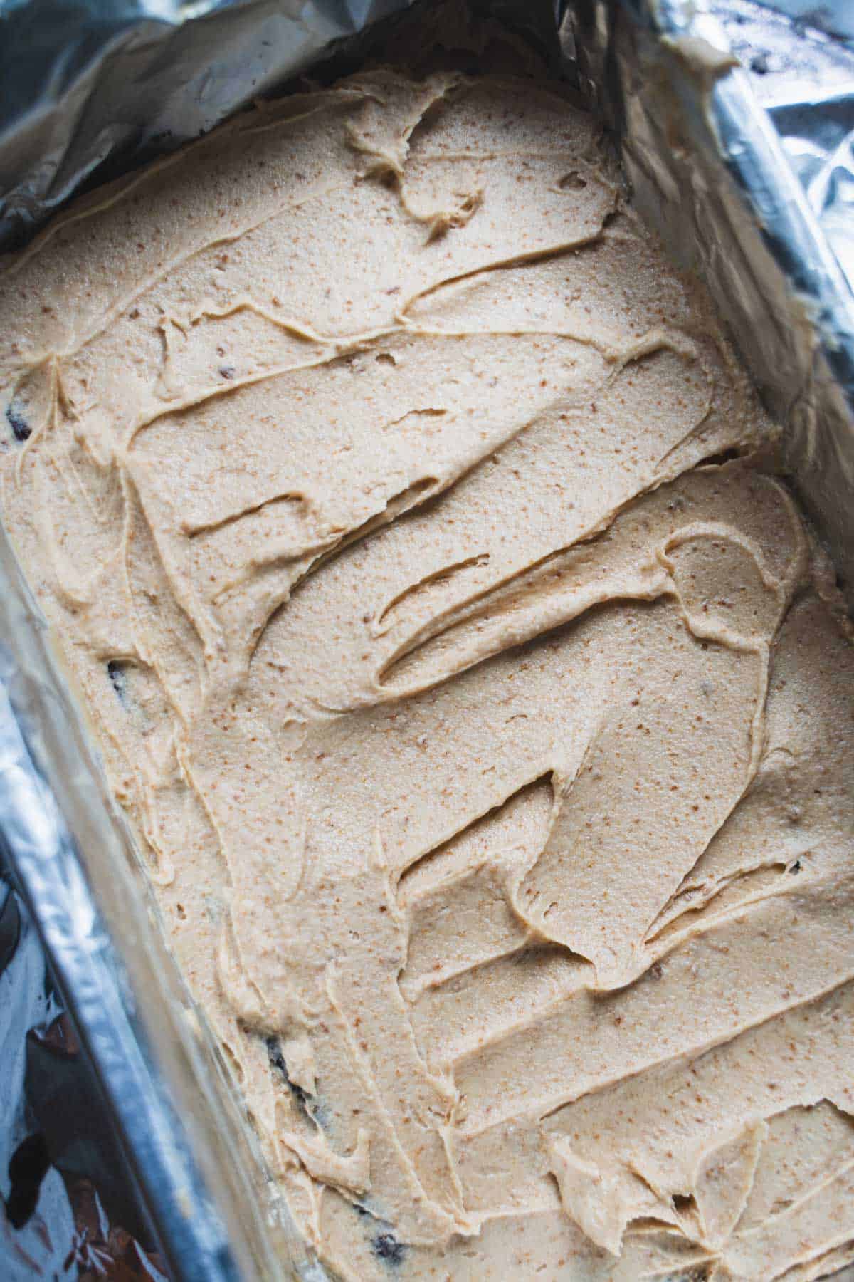 The biscoff cookie butter layer on the brownies set firm in a loaf pan.