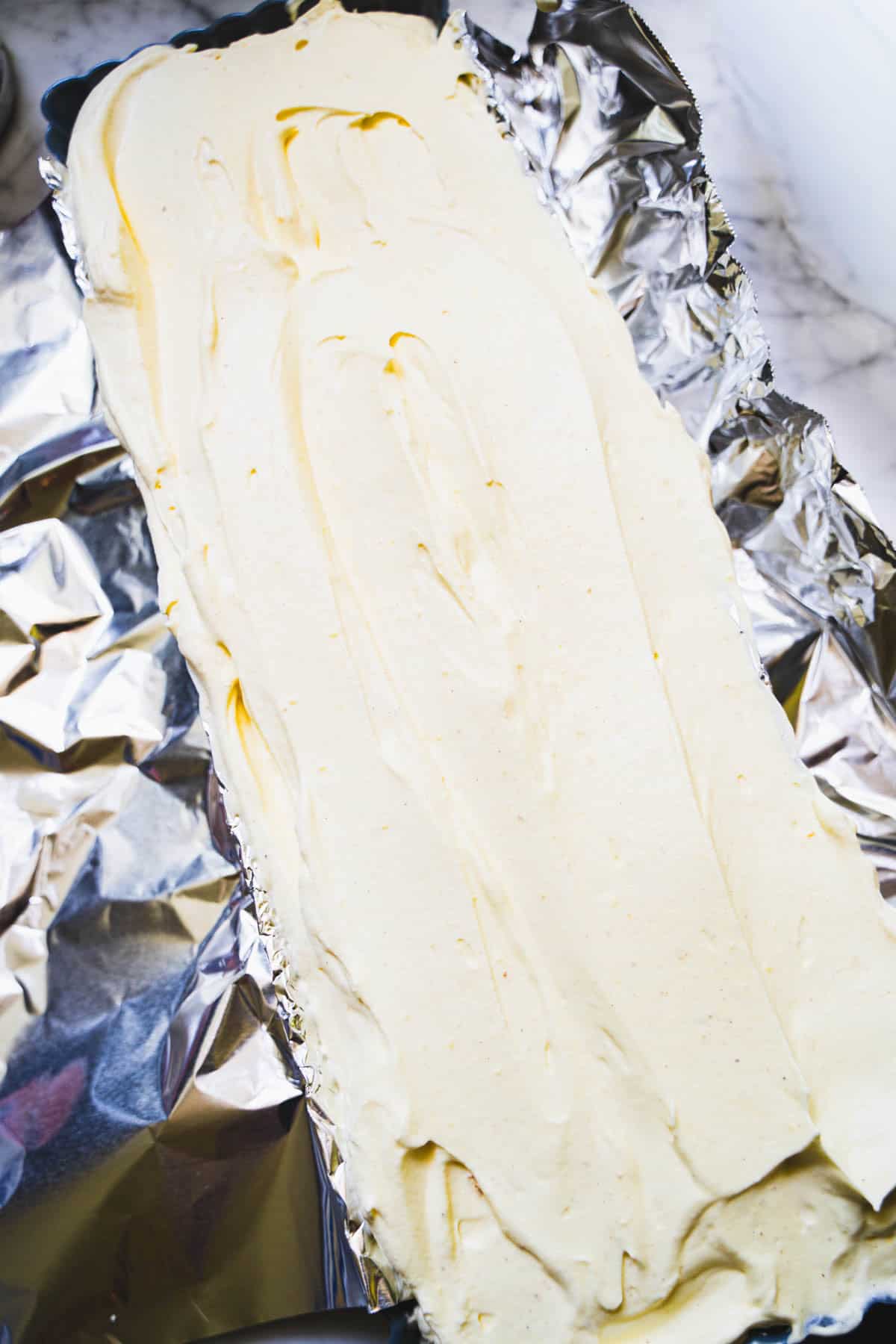 Kulfi ice cream in foil lined tart pan.