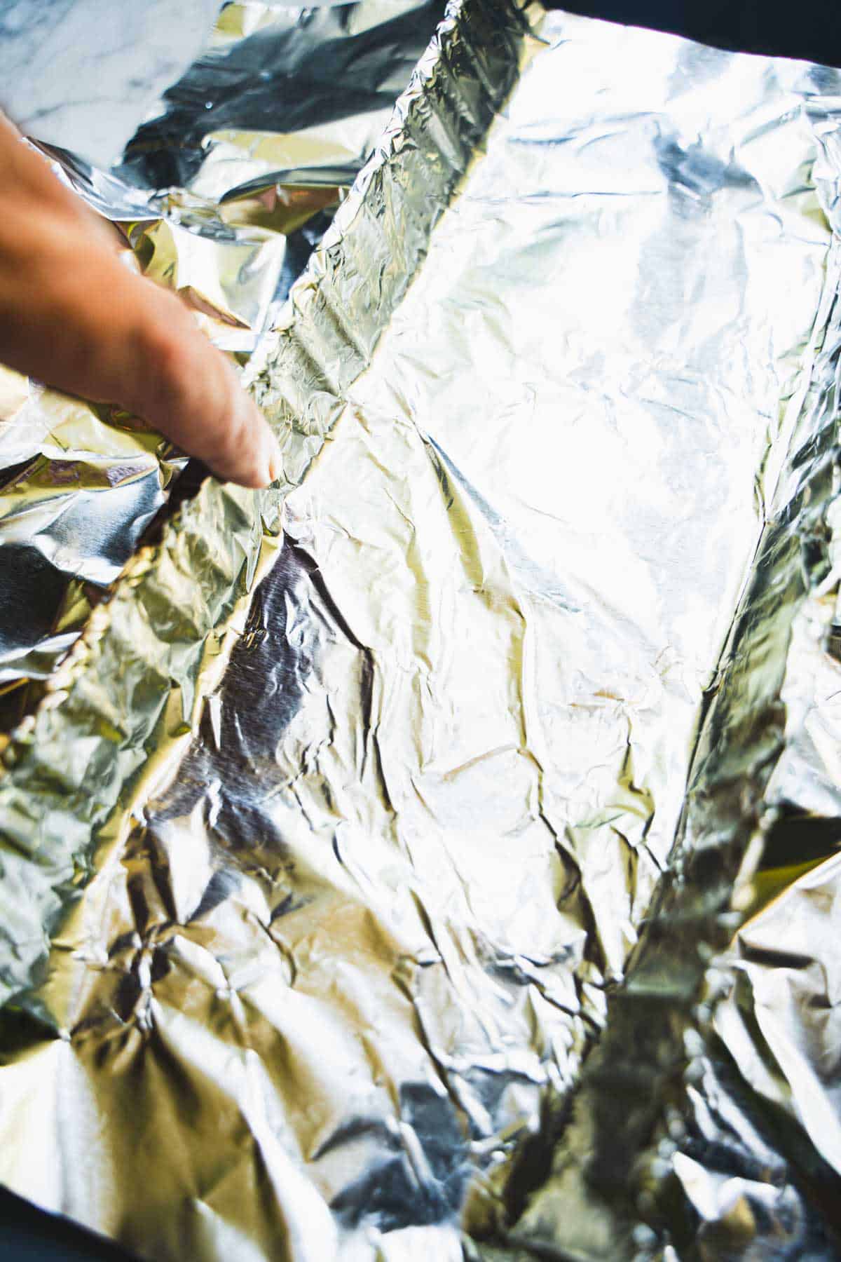 Foil sling inside fluted rectangular tart pan to mold the Kulfi Ice Cream Bars.