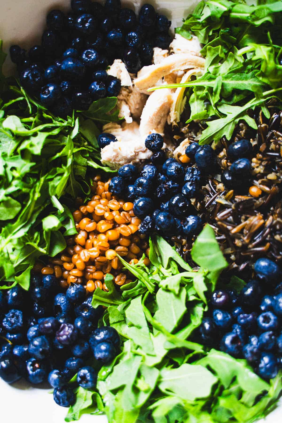 Grain bowl with ingredients in a white bowl.