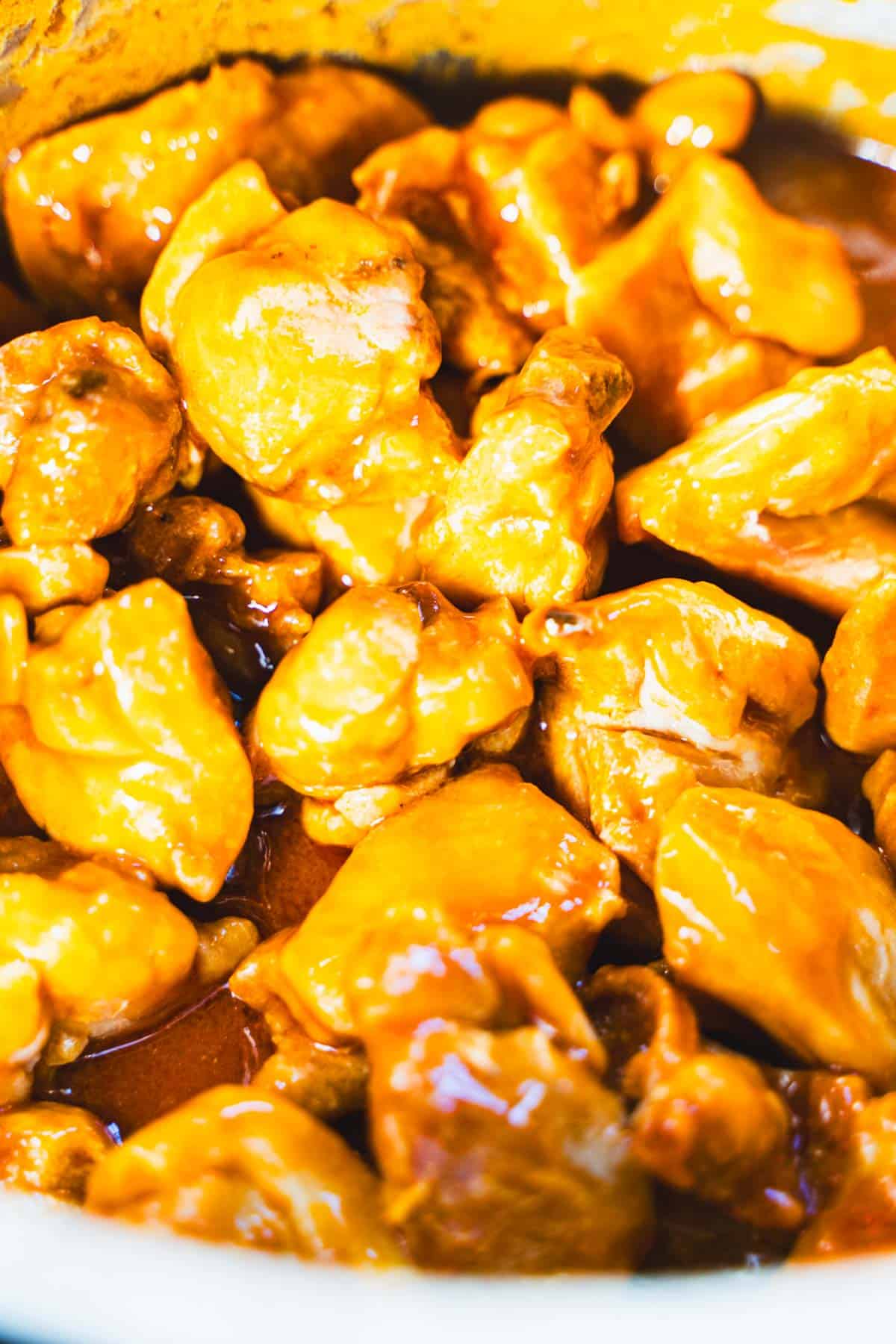 Boiled chicken tossed in buffalo sauce for boneless skinless buffalo chicken.
