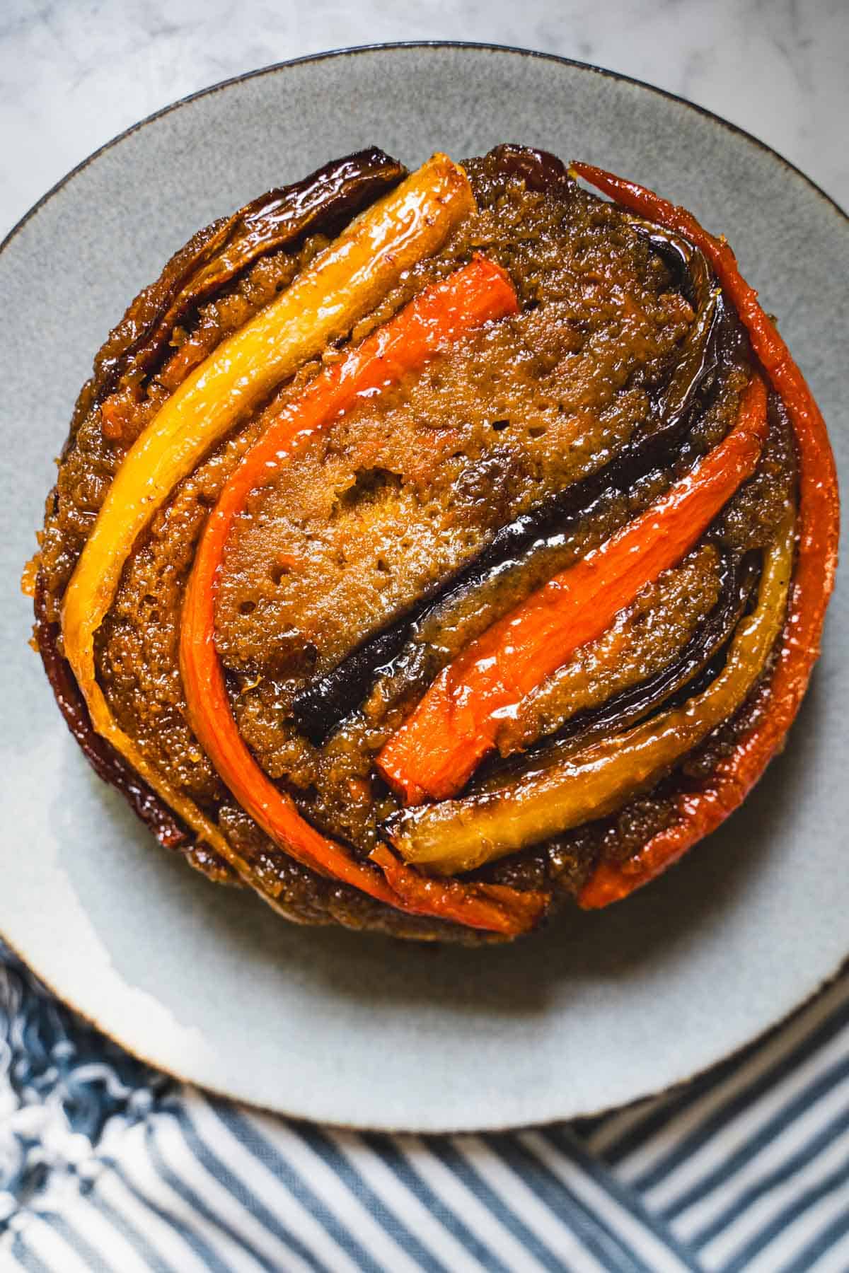 carrot upside down cake on a blue plate.