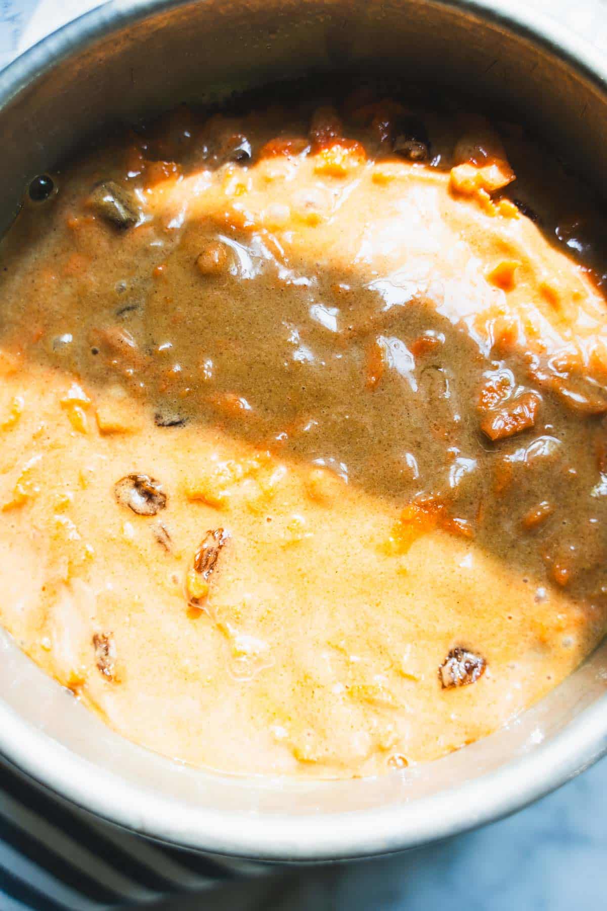 Carrot cake batter in a round 6-inch cake pan.