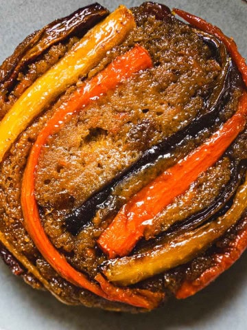 Carrot upside down cake on a blue plate.