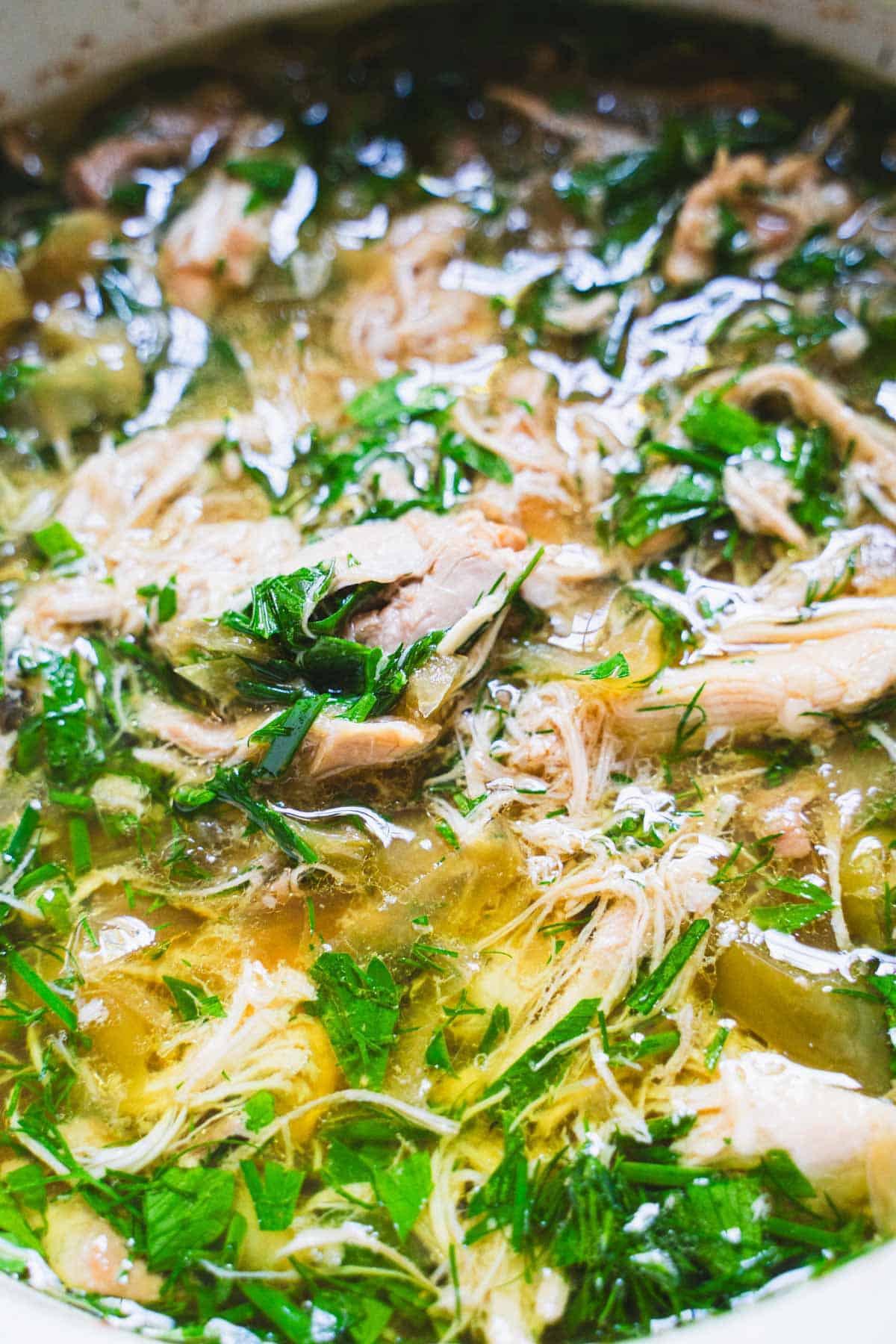 Mississippi Chicken cooked in a small baking dish inside a large slow cooker bowl.